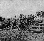Battle of the Somme: British soldiers crossing a rough bridge