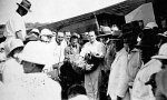 In 1931 Charles Kingsford Smith (left, holding mailbag) delivers the first experimental air mail from Europe to Australia