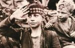 A child in France salutes the allied forces