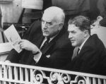 Prime Minister Menzies watching the cricket at Lord's with his son, Ken